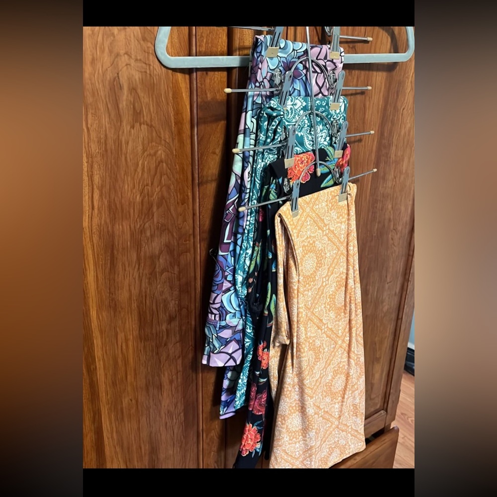 Four pairs of crazy train bell bottoms